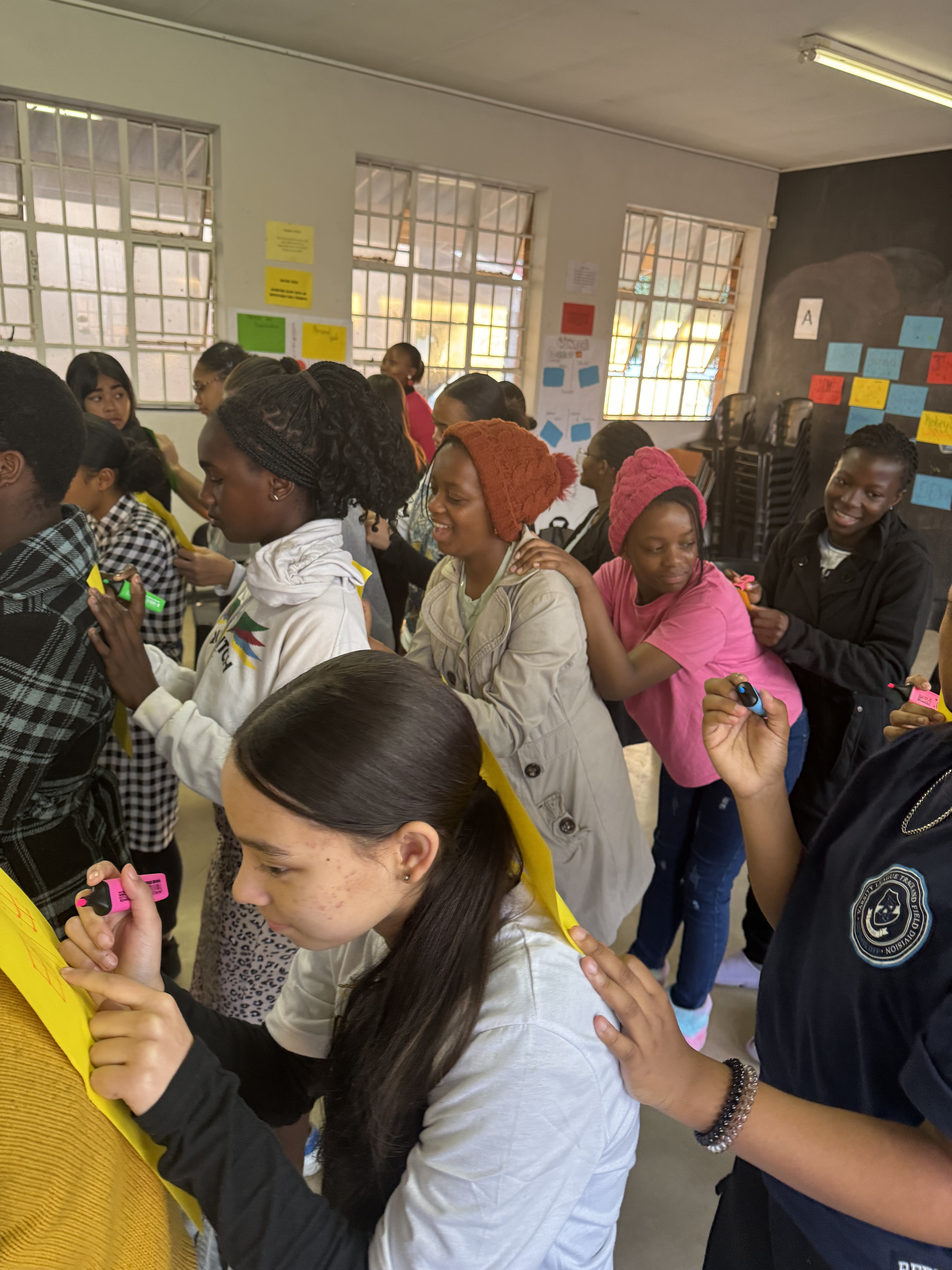 Girls In STEAM workshop participants collaborating on technology project